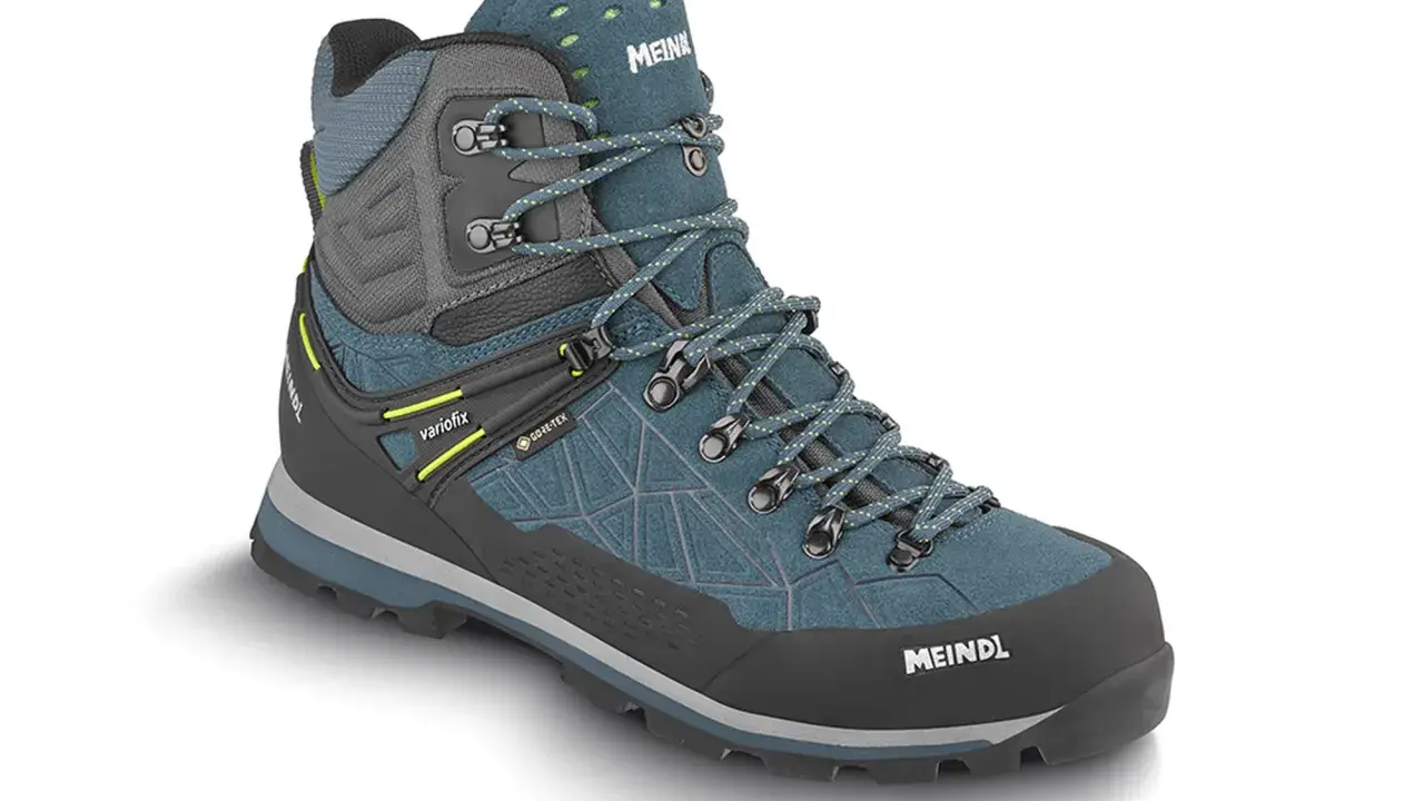 Meindl Lite Hike GTX Test: Ein robuster, wasserdichter Wanderschuh in Petrol und Grau mit Schnürung und Gore-Tex.