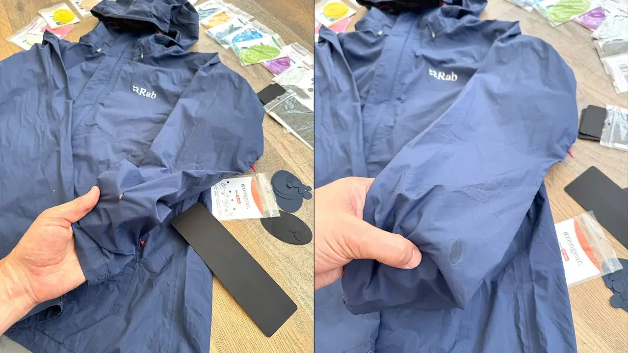 Blaue Regenjacke reparieren: Ein Loch im Ärmel wird mit einem Reparaturflicken ausgebessert. Zubehör für die Regenjacke liegt bereit.
